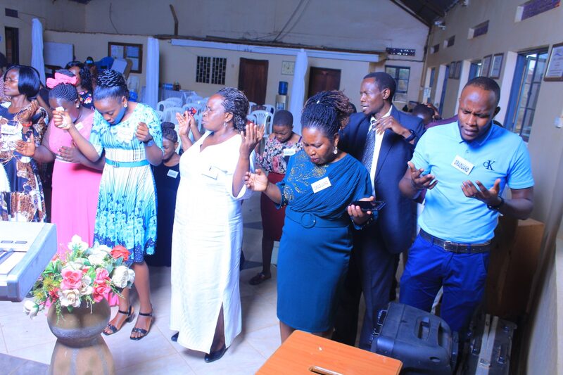 Students and faculty in corporate prayer